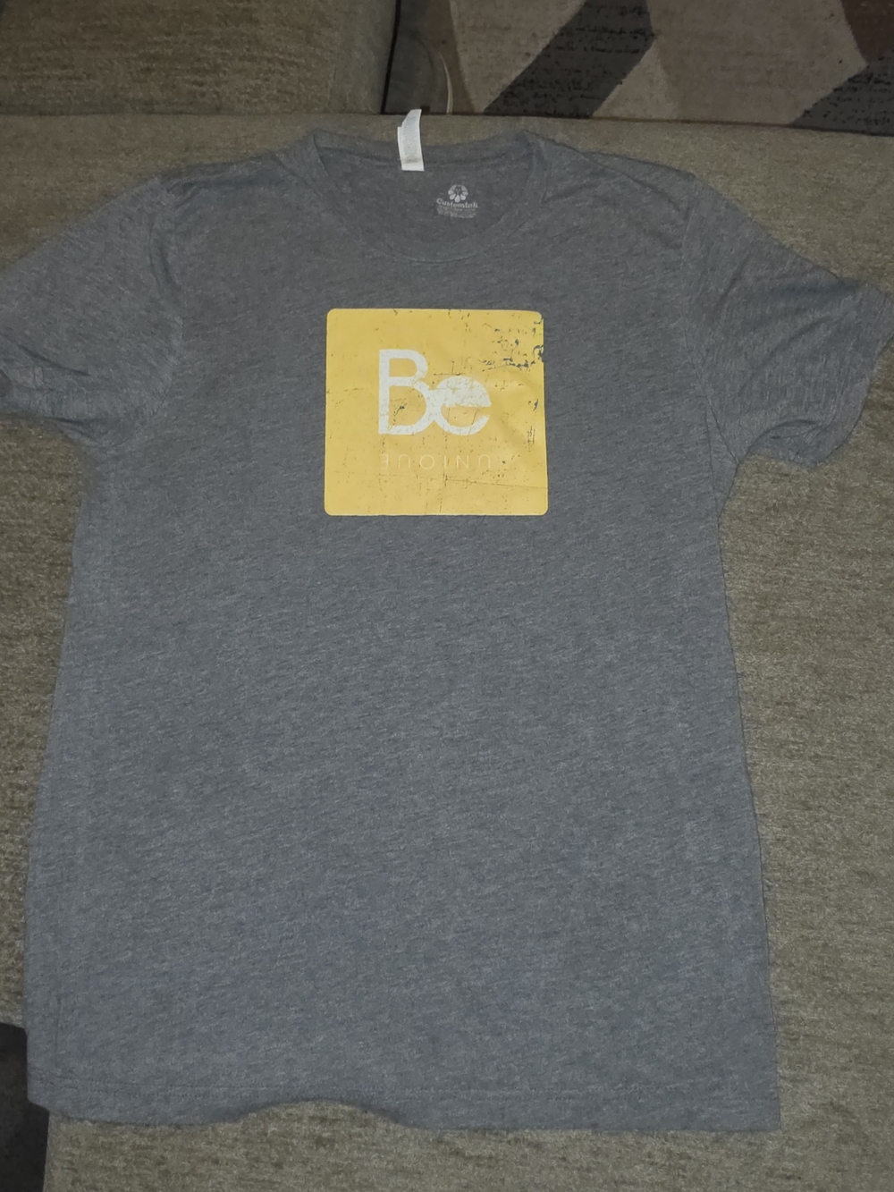 "Be Unique" Gray Graphic Tee with Yellow Logo Medium